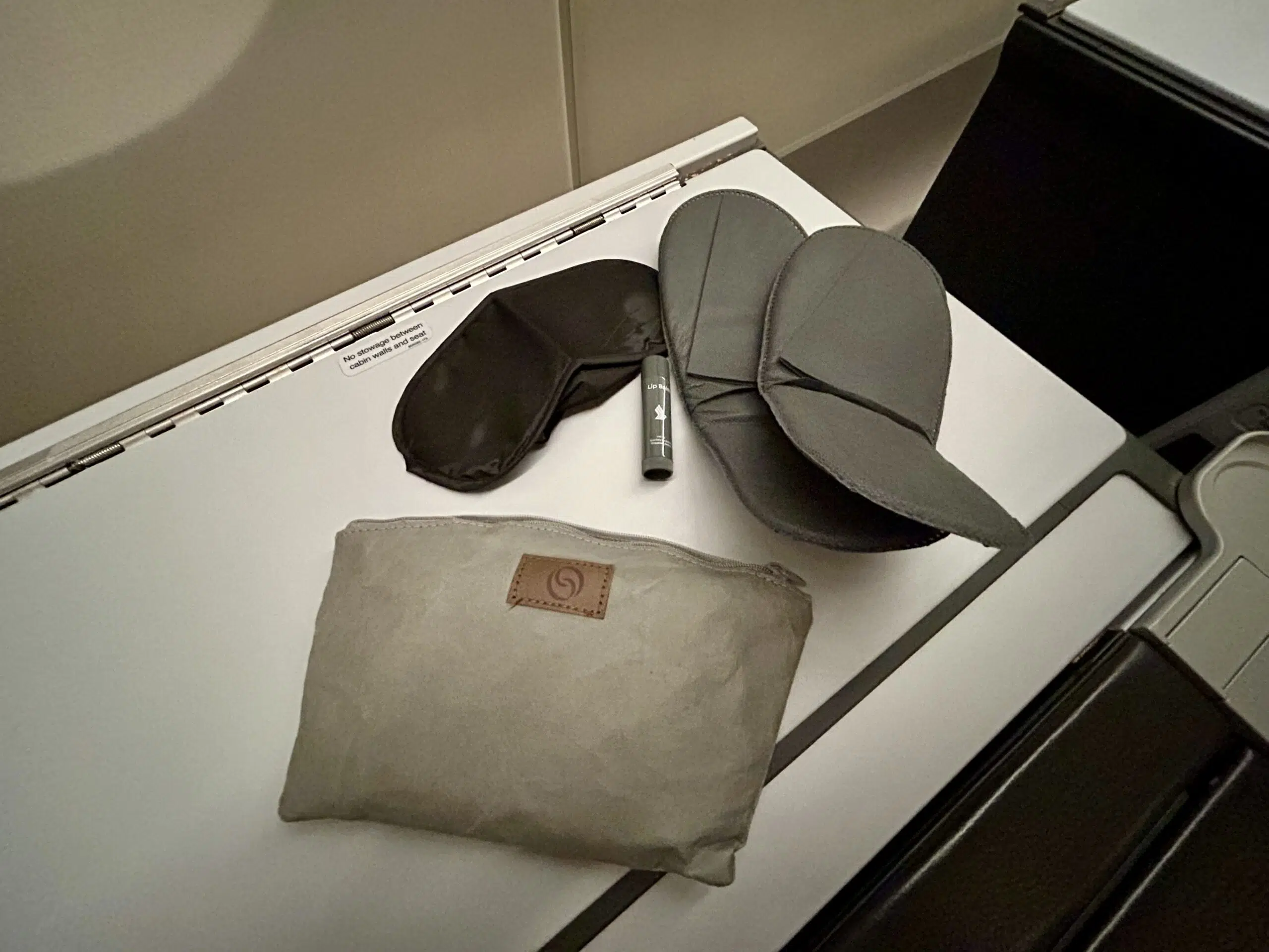 amenity kit with eye mask, lip balm and slippers