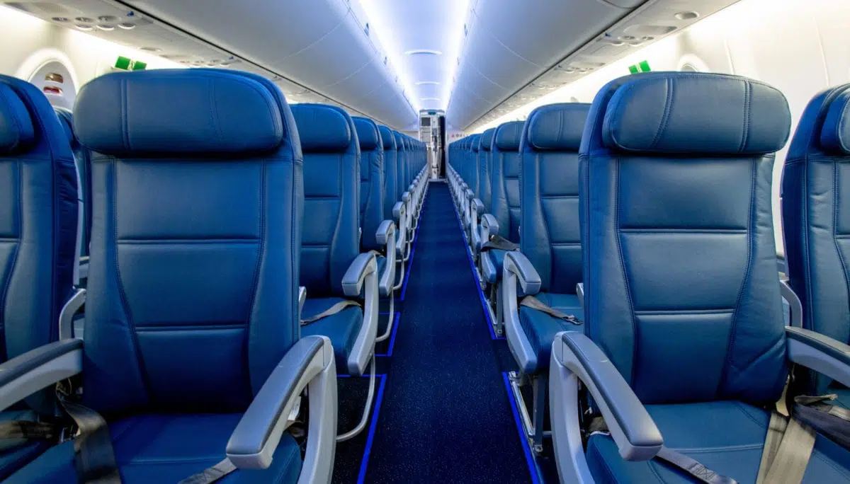 rows of blue leather airplane seats