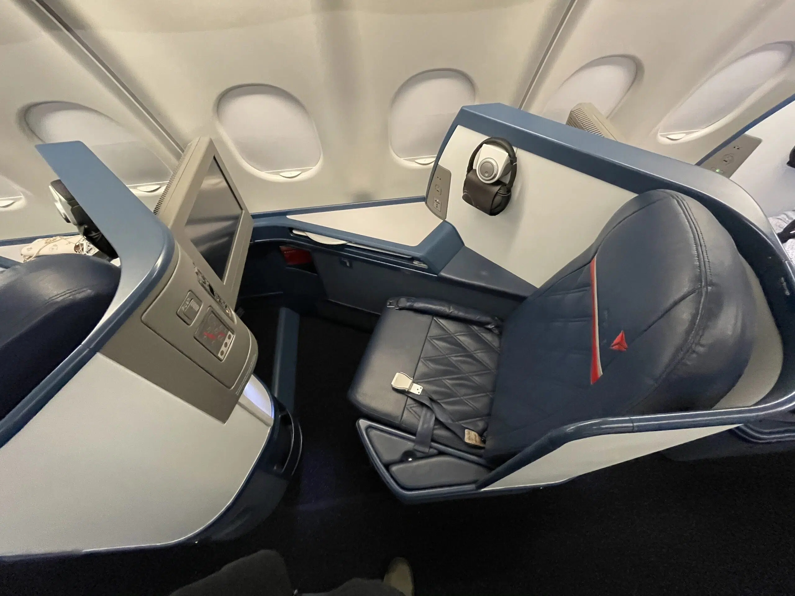 a business class seat on a delta airplane