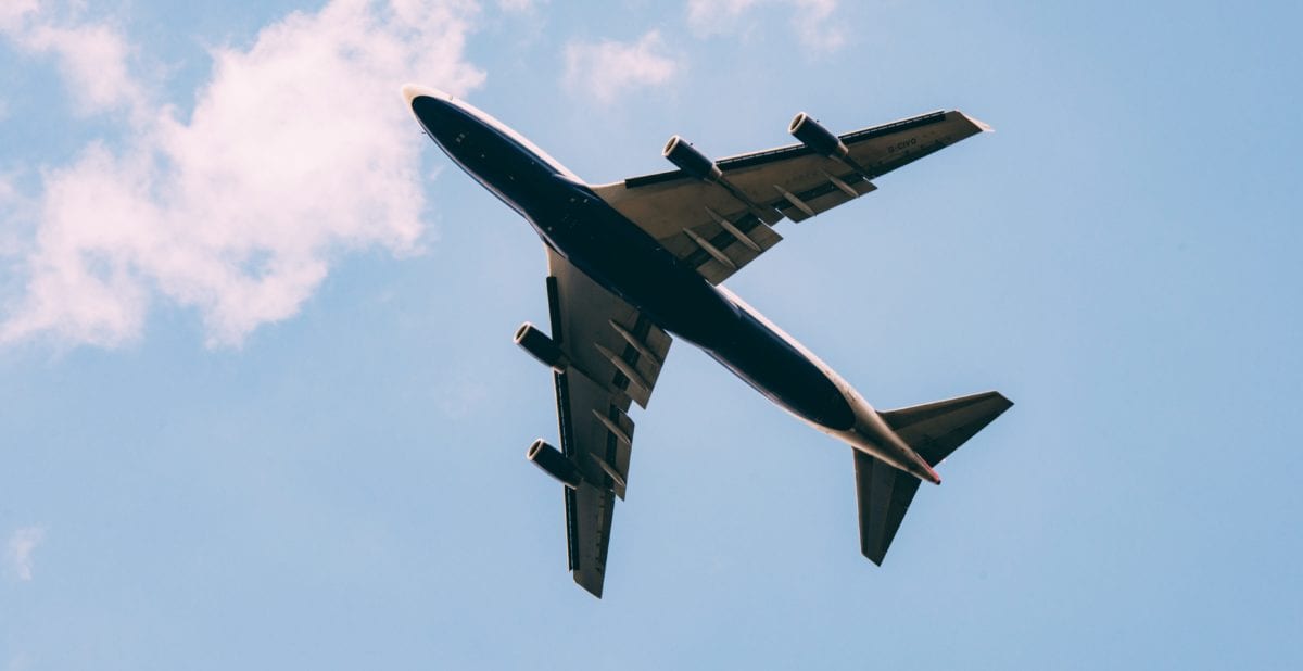 airplane flying through the sky