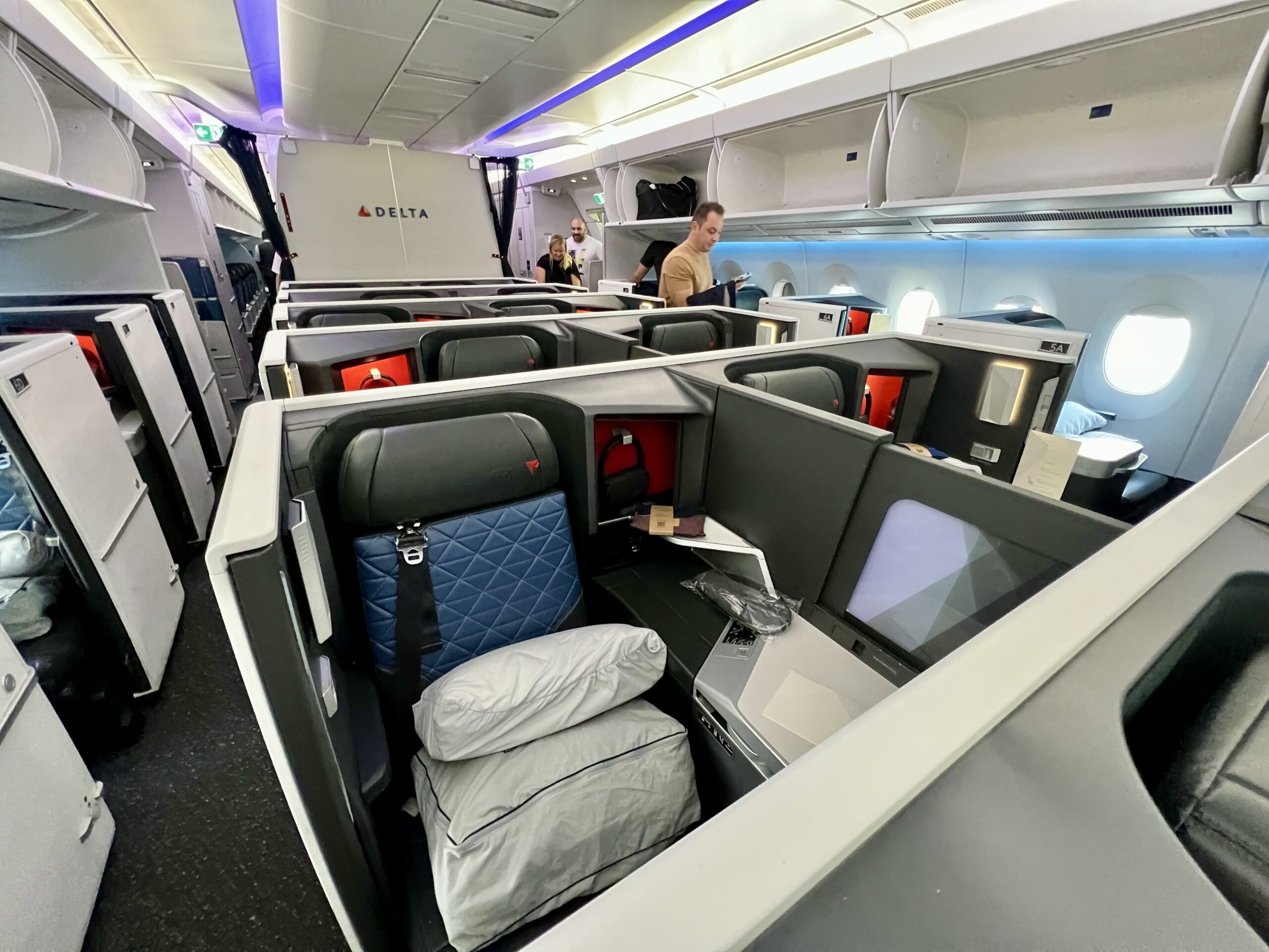 center section of business class suites with a passenger