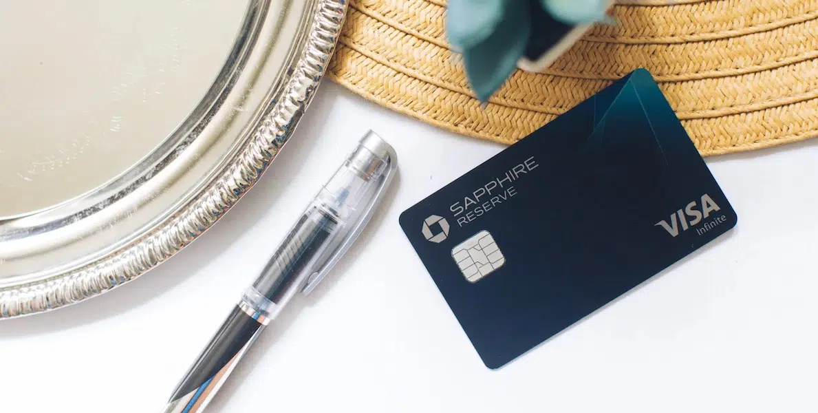 Chase Sapphire Reserve card on a desk with a pen