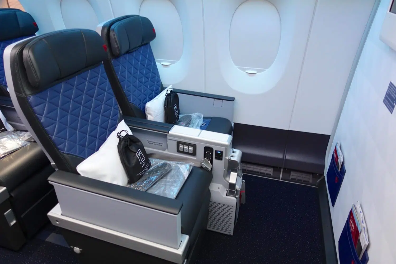 two delta premium select seats with pillows and amenity kits