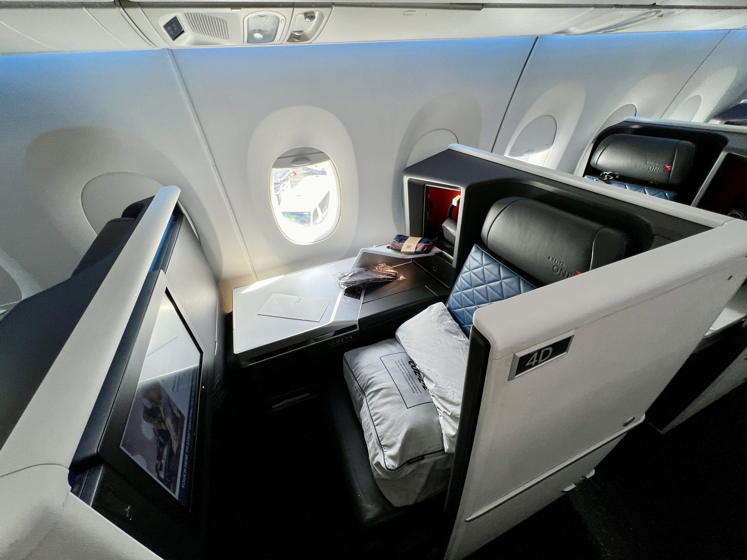 a delta one suite with amenities on the seat