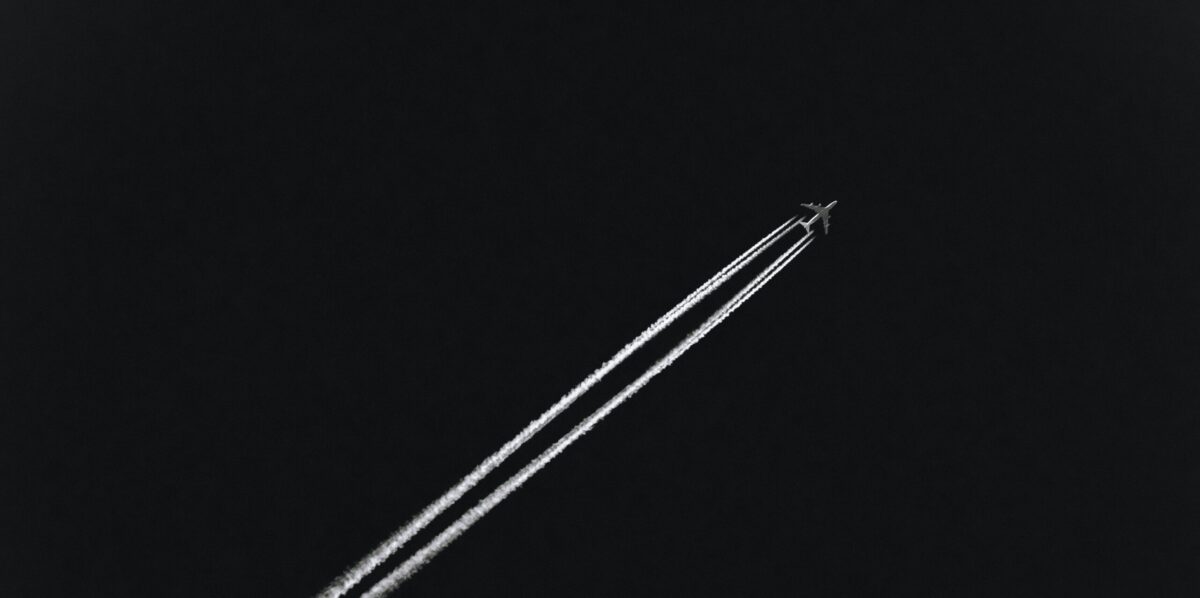 airplane flying through the sky