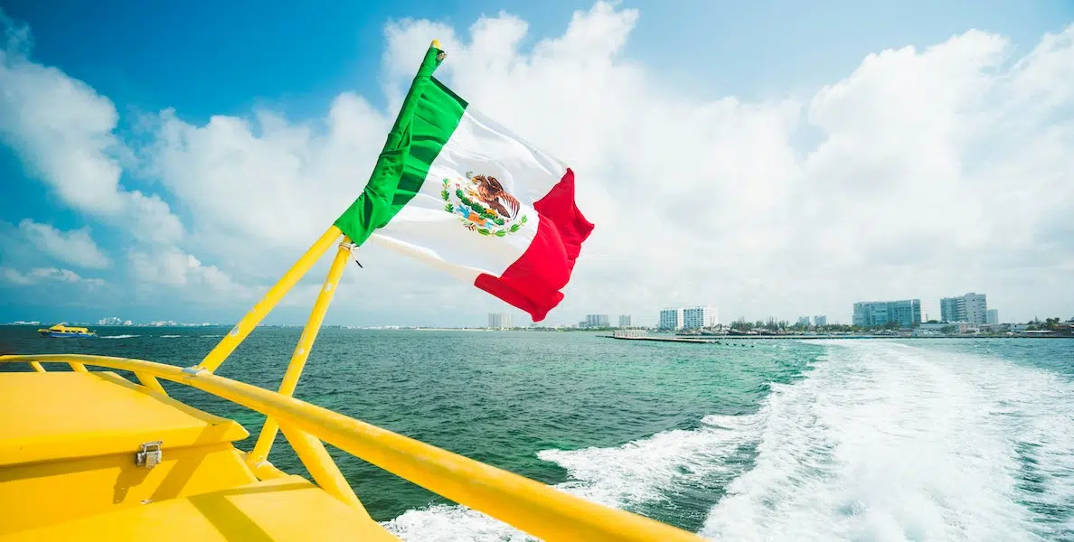 boat driving away from the hotel zone in Cancun, Mexico