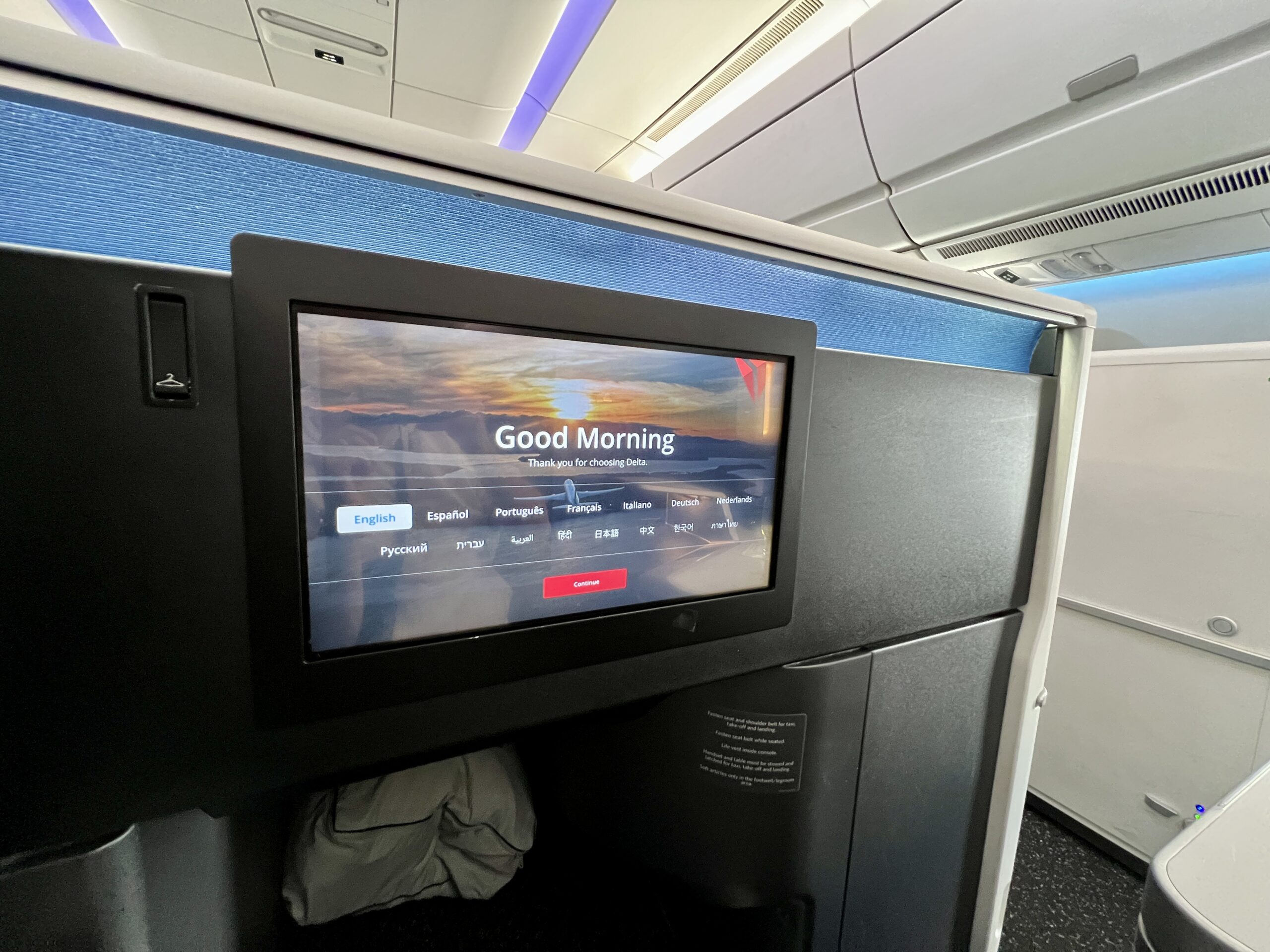 a seatback screen on a business class seat