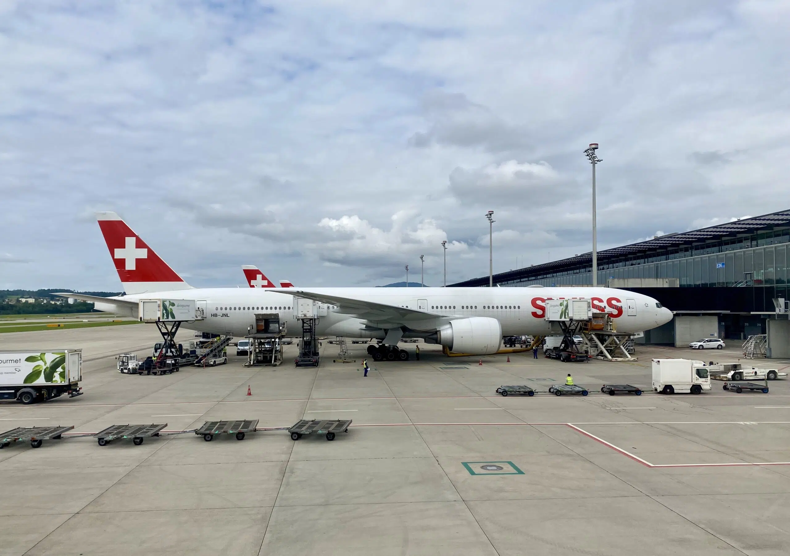 A large passenger jet sitting on top of a tarmac at an airport