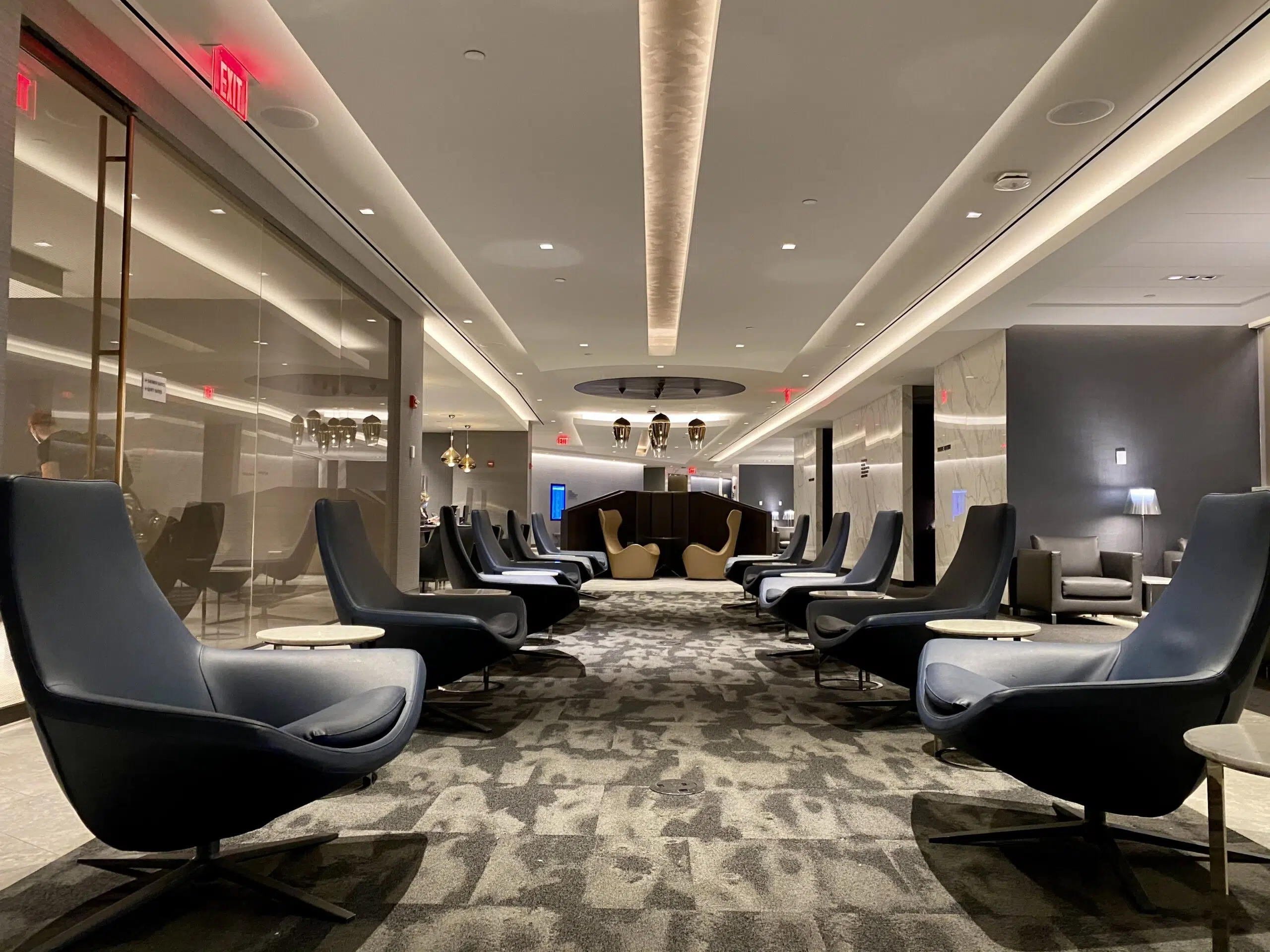 quiet area with armchairs and lighting overhead